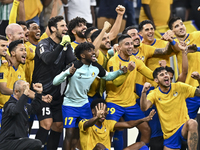 Players of Al Gharafa SC celebrate after winning the AFC Champions League elite west football match between Qatar's Al Gharafa SC and United...