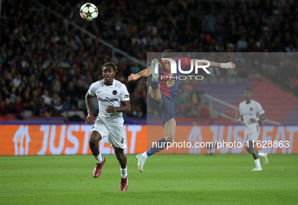 Robert Lewandowski and Tanguy Banhie Zoukro play during the match between FC Barcelona and BSC Young Boys in the week 2 of the League Stage...