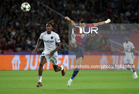 Robert Lewandowski and Tanguy Banhie Zoukro play during the match between FC Barcelona and BSC Young Boys in the week 2 of the League Stage...