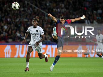 Robert Lewandowski and Tanguy Banhie Zoukro play during the match between FC Barcelona and BSC Young Boys in the week 2 of the League Stage...