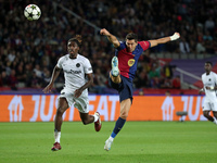 Robert Lewandowski and Tanguy Banhie Zoukro play during the match between FC Barcelona and BSC Young Boys in the week 2 of the League Stage...