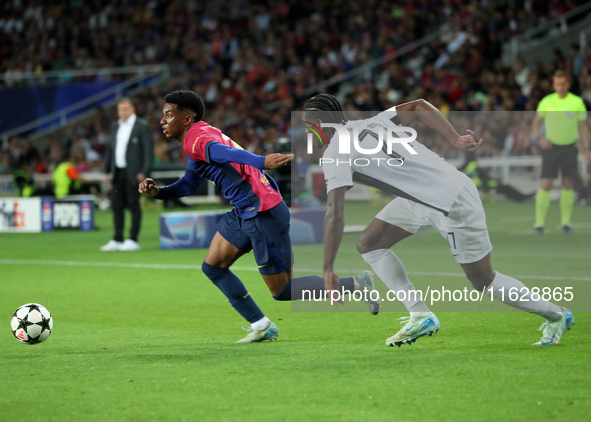 Alejandro Balde and Ebrima Colley play during the match between FC Barcelona and BSC Young Boys in the week 2 of the League Stage of the UEF...