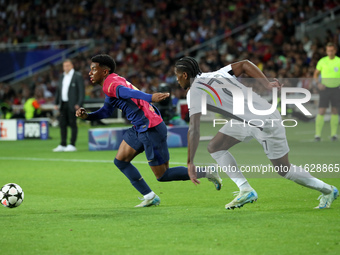 Alejandro Balde and Ebrima Colley play during the match between FC Barcelona and BSC Young Boys in the week 2 of the League Stage of the UEF...