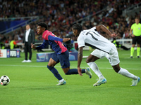 Alejandro Balde and Ebrima Colley play during the match between FC Barcelona and BSC Young Boys in the week 2 of the League Stage of the UEF...