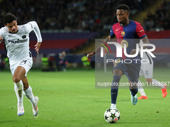 Ansu Fati and Zachary Athekame play during the match between FC Barcelona and BSC Young Boys in the week 2 of the League Stage of the UEFA C...