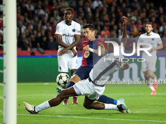 Robert Lewandowski and Mohamed Camara play during the match between FC Barcelona and BSC Young Boys in the week 2 of the League Stage of the...