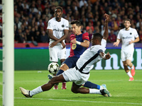 Robert Lewandowski and Mohamed Camara play during the match between FC Barcelona and BSC Young Boys in the week 2 of the League Stage of the...