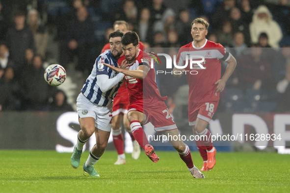 Finn Azaz of Middlesbrough battles for the ball with Alex Mowatt of West Bromwich Albion during the Sky Bet Championship match between West...