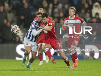 Finn Azaz of Middlesbrough battles for the ball with Alex Mowatt of West Bromwich Albion during the Sky Bet Championship match between West...