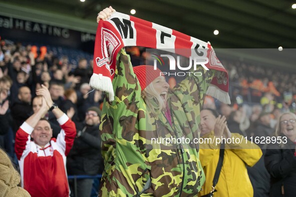 Middlesbrough fans celebrate at the final whistle during the Sky Bet Championship match between West Bromwich Albion and Middlesbrough at Th...