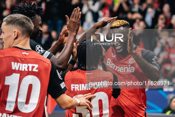 Victor Boniface of Bayer 04 Leverkusen celebrates with teammates after scoring a goal, which is later disallowed for offside, during the UEF...