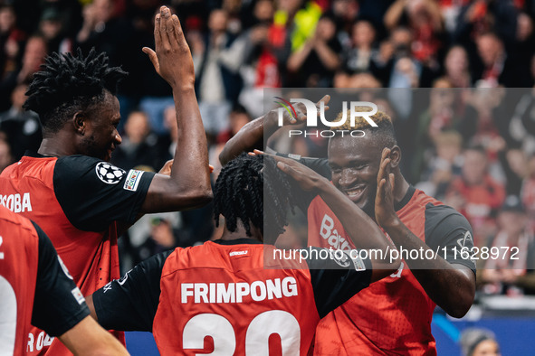 Victor Boniface of Bayer 04 Leverkusen celebrates with teammates after scoring a goal, which is later disallowed for offside, during the UEF...