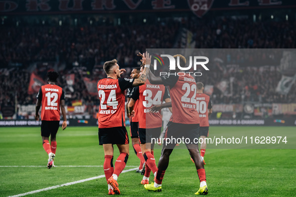 Victor Boniface of Bayer 04 Leverkusen celebrates with teammates after scoring a goal, which is later disallowed for offside, during the UEF...