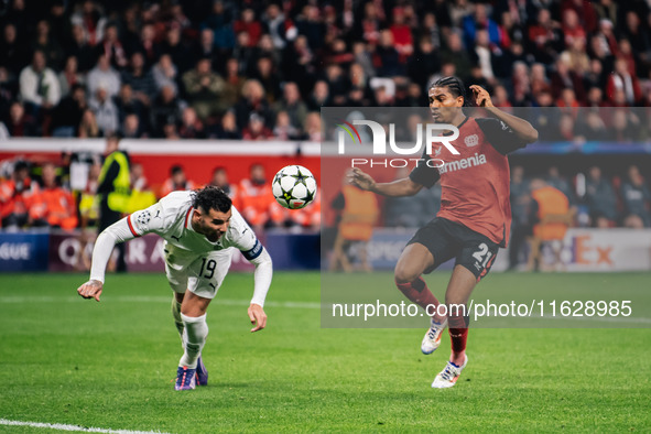 Amine Adli of Bayer 04 Leverkusen and Theo Hernandez of AC Milan are in action during the UEFA Champions League 2024/25 League Phase MD2 mat...