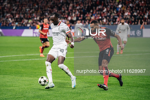 Tammy Abraham of AC Milan and Jonathan Tah of Bayer 04 Leverkusen are in action during the UEFA Champions League 2024/25 League Phase MD2 ma...