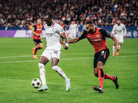 Tammy Abraham of AC Milan and Jonathan Tah of Bayer 04 Leverkusen are in action during the UEFA Champions League 2024/25 League Phase MD2 ma...