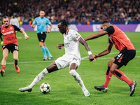 Tammy Abraham of AC Milan and Jonathan Tah of Bayer 04 Leverkusen are in action during the UEFA Champions League 2024/25 League Phase MD2 ma...