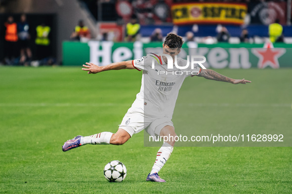 Christian Pulisic of AC Milan shoots the ball during the UEFA Champions League 2024/25 League Phase MD2 match between Bayer 04 Leverkusen an...