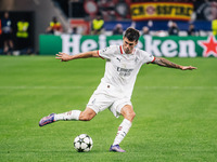 Christian Pulisic of AC Milan shoots the ball during the UEFA Champions League 2024/25 League Phase MD2 match between Bayer 04 Leverkusen an...