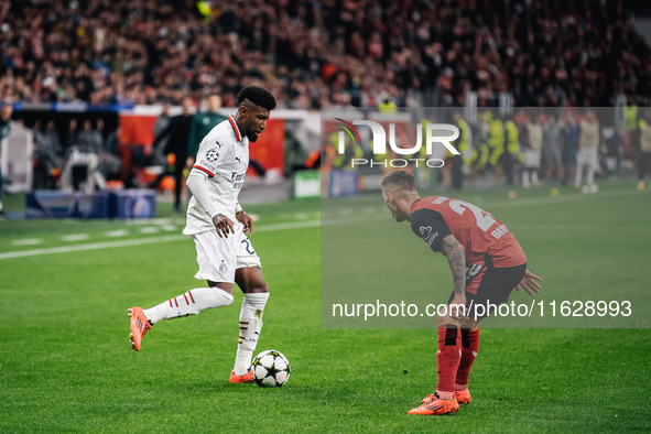 Alejandro Grimaldo of Bayer 04 Leverkusen and Emerson of AC Milan are in action during the UEFA Champions League 2024/25 League Phase MD2 ma...