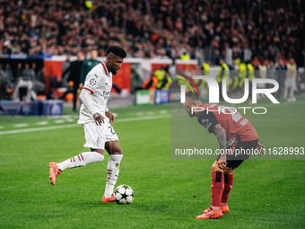 Alejandro Grimaldo of Bayer 04 Leverkusen and Emerson of AC Milan are in action during the UEFA Champions League 2024/25 League Phase MD2 ma...