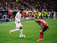 Alejandro Grimaldo of Bayer 04 Leverkusen and Emerson of AC Milan are in action during the UEFA Champions League 2024/25 League Phase MD2 ma...