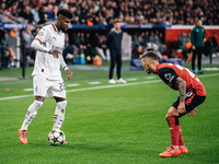 Alejandro Grimaldo of Bayer 04 Leverkusen and Emerson of AC Milan are in action during the UEFA Champions League 2024/25 League Phase MD2 ma...