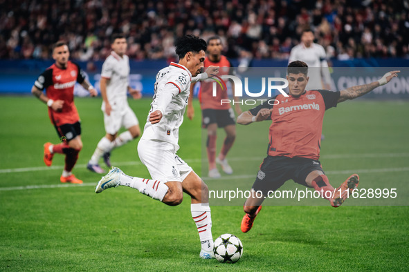 Tijjani Reijnders of AC Milan and Piero Hincapie of Bayer 04 Leverkusen are in action during the UEFA Champions League 2024/25 League Phase...