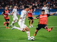 Tijjani Reijnders of AC Milan and Piero Hincapie of Bayer 04 Leverkusen are in action during the UEFA Champions League 2024/25 League Phase...