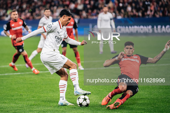 Tijjani Reijnders of AC Milan and Piero Hincapie of Bayer 04 Leverkusen are in action during the UEFA Champions League 2024/25 League Phase...