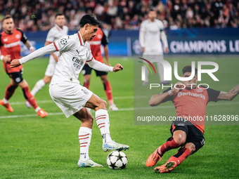 Tijjani Reijnders of AC Milan and Piero Hincapie of Bayer 04 Leverkusen are in action during the UEFA Champions League 2024/25 League Phase...