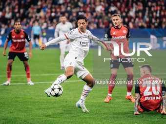 Tijjani Reijnders of AC Milan is in action during the UEFA Champions League 2024/25 League Phase MD2 match between Bayer 04 Leverkusen and A...