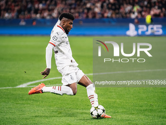 Emerson of AC Milan shoots the ball during the UEFA Champions League 2024/25 League Phase MD2 match between Bayer 04 Leverkusen and AC Milan...