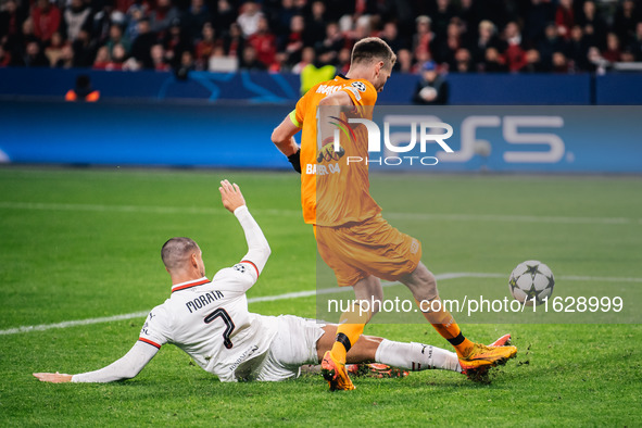 Alvaro Morata of AC Milan and Lukas Hradecky of Bayer 04 Leverkusen are in action during the UEFA Champions League 2024/25 League Phase MD2...