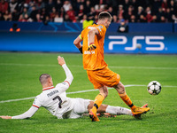 Alvaro Morata of AC Milan and Lukas Hradecky of Bayer 04 Leverkusen are in action during the UEFA Champions League 2024/25 League Phase MD2...