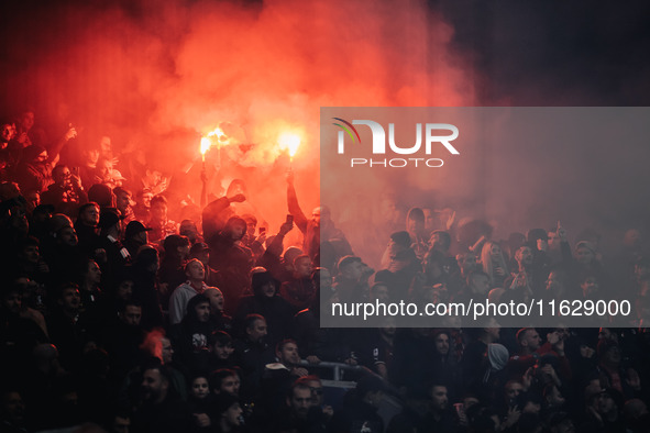 Fans of AC Milan light pyros during the UEFA Champions League 2024/25 League Phase MD2 match between Bayer 04 Leverkusen and AC Milan at Bay...