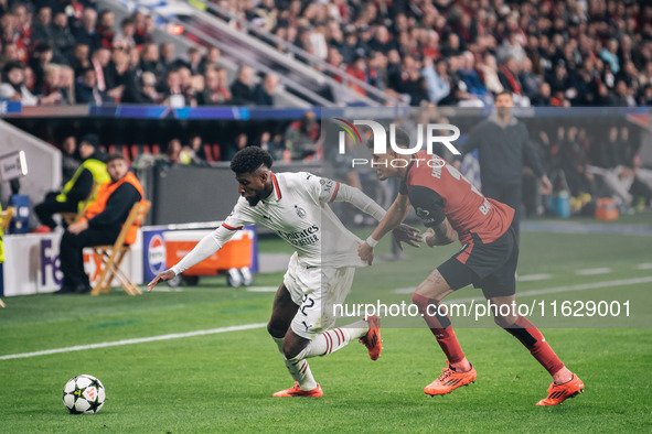 Emerson of AC Milan and Piero Hincapie of Bayer 04 Leverkusen are in action during the UEFA Champions League 2024/25 League Phase MD2 match...