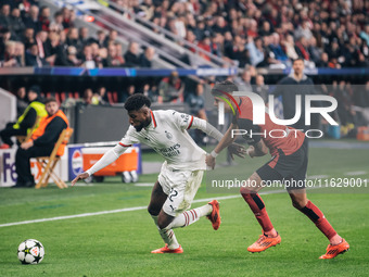 Emerson of AC Milan and Piero Hincapie of Bayer 04 Leverkusen are in action during the UEFA Champions League 2024/25 League Phase MD2 match...