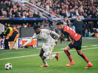 Emerson of AC Milan and Piero Hincapie of Bayer 04 Leverkusen are in action during the UEFA Champions League 2024/25 League Phase MD2 match...