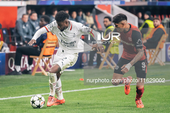 Emerson of AC Milan and Piero Hincapie of Bayer 04 Leverkusen are in action during the UEFA Champions League 2024/25 League Phase MD2 match...