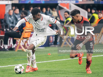 Emerson of AC Milan and Piero Hincapie of Bayer 04 Leverkusen are in action during the UEFA Champions League 2024/25 League Phase MD2 match...