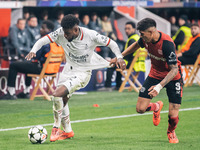 Emerson of AC Milan and Piero Hincapie of Bayer 04 Leverkusen are in action during the UEFA Champions League 2024/25 League Phase MD2 match...