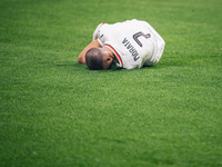 Alvaro Morata of AC Milan lies on the ground after getting tackled during the UEFA Champions League 2024/25 League Phase MD2 match between B...