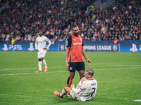 Jonathan Tah of Bayer 04 Leverkusen speaks to Alvaro Morata of AC Milan during the UEFA Champions League 2024/25 League Phase MD2 match betw...