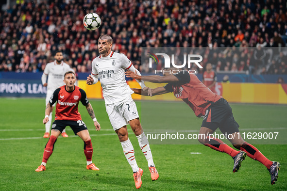 Alvaro Morata of AC Milan and Jonathan Tah of Bayer 04 Leverkusen are in action during the UEFA Champions League 2024/25 League Phase MD2 ma...