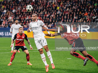 Alvaro Morata of AC Milan and Jonathan Tah of Bayer 04 Leverkusen are in action during the UEFA Champions League 2024/25 League Phase MD2 ma...