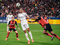 Alvaro Morata of AC Milan and Jonathan Tah of Bayer 04 Leverkusen are in action during the UEFA Champions League 2024/25 League Phase MD2 ma...