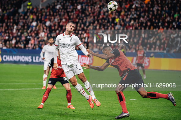 Alvaro Morata of AC Milan and Jonathan Tah of Bayer 04 Leverkusen are in action during the UEFA Champions League 2024/25 League Phase MD2 ma...