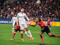 Alvaro Morata of AC Milan and Jonathan Tah of Bayer 04 Leverkusen are in action during the UEFA Champions League 2024/25 League Phase MD2 ma...