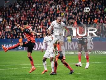 Alvaro Morata of AC Milan and Edmond Tapsoba of Bayer 04 Leverkusen are in action during the UEFA Champions League 2024/25 League Phase MD2...